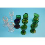 A collection of glass eye baths, seven green, one blue and 3 clear glass. (11)