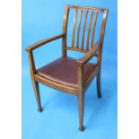 An Edwardian mahogany extending dining table with one extra leaf and a set of six mahogany chairs