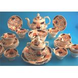 A Victorian tea set comprising teapot, sucrier, slop bowl, 2 cake plates, 12 cups and saucers.