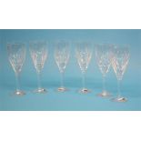 A boxed set of six Waterford Crystal wine glasses and a boxed pair of tall champagne flutes.