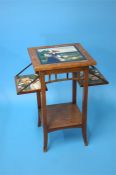 An Aesthetic style fold occasional table, the top inset with a decorative tile and each folding