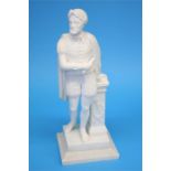 A white marble carved figure of a man holding a scroll, resting on a plinth, supported on a carved