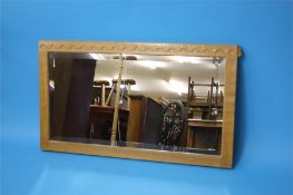 A Robert "Mouseman" Thompson rectangular mirror with bevelled glass and carved mouse.  106 cm