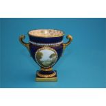 A small Royal Worcester Campagna shaped vase, the front decorated in enamels with a view of