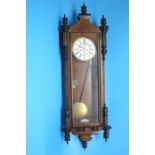 A walnut cased double weight Vienna regulator clock with painted enamel dial, 8 day movement, second