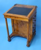 A Victorian walnut Davenport with brass gallery, rising top, with 4 frieze drawer with turned wood