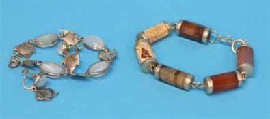 A silver mounted agate bracelet and a silver mounted moonstone (?) bracelet with matching earrings.