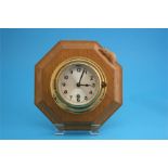 A Robert "Mouseman" Thompson oak wall clock with silvered dial, octagonal case with carved mouse.