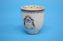 A small Chinese armorial cup with gilt and blue edge and looped handles.  6.5 cm high