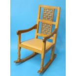 A Robert "Mouseman" Thompson oak rocking chair with a double latticework  back and carved mouse to