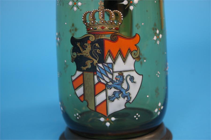 A German clear glass double oil/vinegar dispensing bottle decorated with enamel armorials; and a - Image 2 of 4