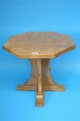 A Robert "Mouseman" Thompson oak octagonal coffee table, on a cruciform support with carved