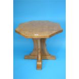 A Robert "Mouseman" Thompson oak octagonal coffee table, on a cruciform support with carved