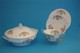 A Shelley porcelain dinner service decorated with floral sprays, comprising gravy boat, 3 meat