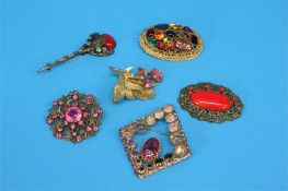 Six decorative costume brooches.