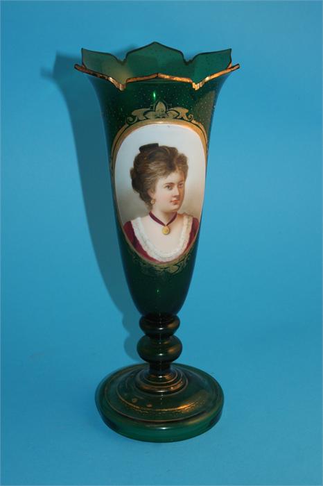 A Victorian green glass spill vase with flared rim, the centre depicting an oval painted portrait of
