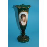 A Victorian green glass spill vase with flared rim, the centre depicting an oval painted portrait of