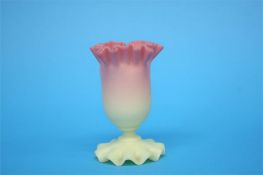 A Victorian Burmese glass vase in the manner of Thomas Webb with frilled rim and foot.  10 cm high.