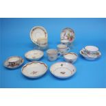 Five tea bowls and saucers and a spare bowl, each decorated with a sprig of flowers, 4 cups and