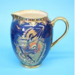 A Carlton Ware water jug decorated with an Art Deco style dancing figure, the reverse decorated with
