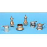 A silver 2 piece condiment set, Birmingham 1923 and four various silver mounted mustard pots,