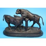 After "Mene" a modern bronze of a bull and a heifer beside a fence.  50 cm long