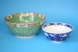 A large Chinese Canton enamel circular bowl decorated with butterflies and flowers and a small