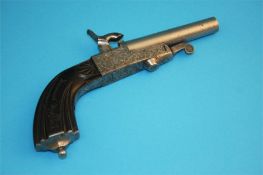 A small percussion pistol with single barrel, engraved frame and carved stock. Stamped FF and