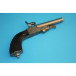 A small percussion pistol with single barrel, engraved frame and carved stock. Stamped FF and