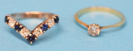An 18ct white gold sapphire and diamond wishbone ring and a solitaire diamond ring.  Ring size N and