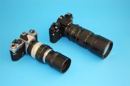 Two Nikon FM2 cameras with lenses.