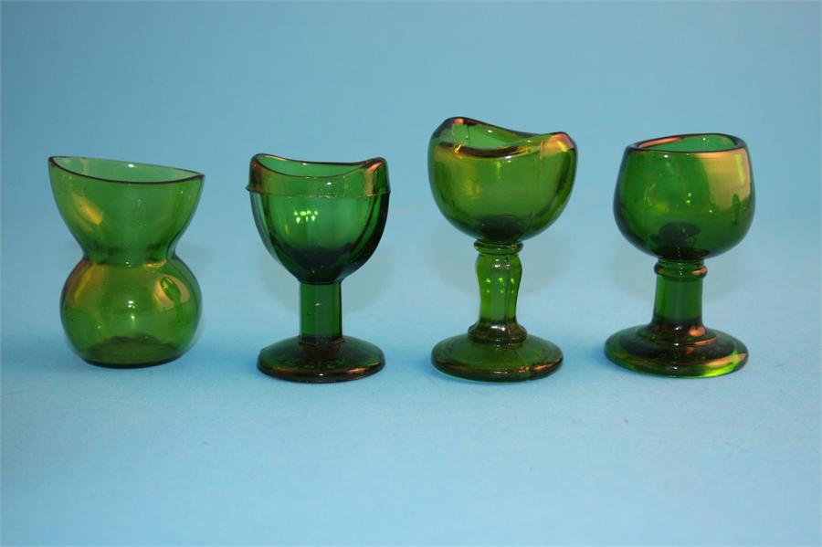 A collection of glass eye baths, seven green, one blue and 3 clear glass. (11) - Image 3 of 4