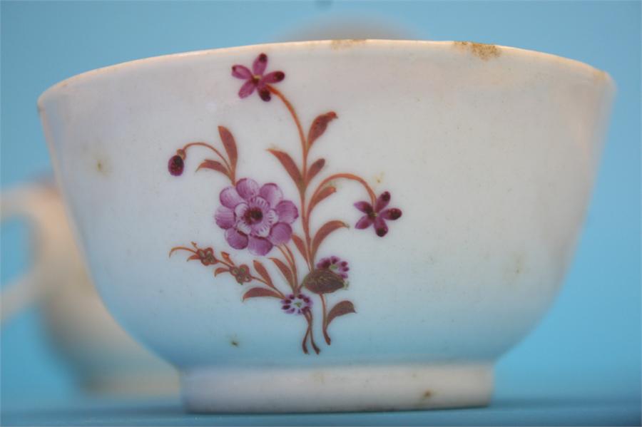 Five tea bowls and saucers and a spare bowl, each decorated with a sprig of flowers, 4 cups and - Image 5 of 5