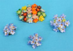 Two floral brooches and a pair of earrings.