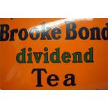 A "Brooke Bond Dividend Tea" enamelled sign on an orange background.  76 cm wide  51 cm high