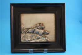 A pair of decorative Oriental relief plaques each depicting lions and tigers, signed A Mayer.  20