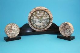 A 1930's Art Deco clock garniture with circular granite dial, supported on a slate base.  39 cm