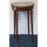 A mahogany oval bedside table with raised gallery and slide below, the whole supported on slender