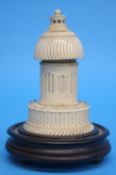 An unusual ivory scent bottle in the form of a folly, the top with screw top revealing a scent