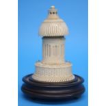 An unusual ivory scent bottle in the form of a folly, the top with screw top revealing a scent