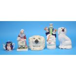 A Staffordshire pottery spaniel's head money box and four various pieces of Staffordshire