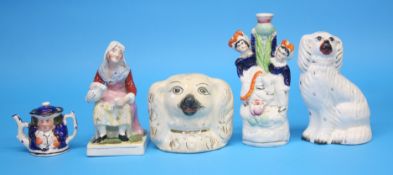 A Staffordshire pottery spaniel's head money box and four various pieces of Staffordshire