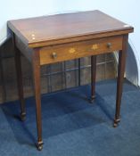 An Edwardian mahogany fold over card table with single drawer supported on square tapering legs.  63