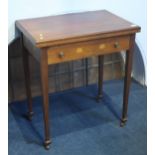 An Edwardian mahogany fold over card table with single drawer supported on square tapering legs.  63