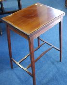 An Edwardian mahogany fold over card table.