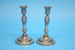 A pair of silver plated Christofle candlesticks.