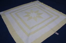 A Durham quilt with yellow star decoration and 3 outer borders and floral reverse.  211 cm x 204 cm