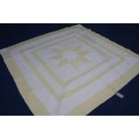 A Durham quilt with yellow star decoration and 3 outer borders and floral reverse.  211 cm x 204 cm