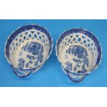 A pair of 19th century willow pattern two handled oval porcelain lattice work baskets.  26 cm wide