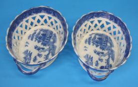 A pair of 19th century willow pattern two handled oval porcelain lattice work baskets.  26 cm wide